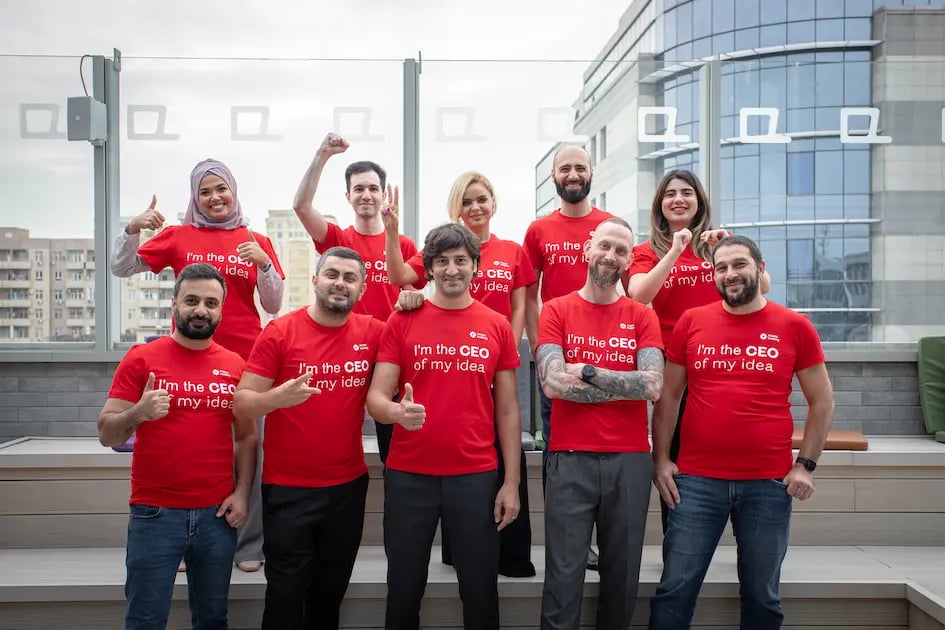 A group of innovators in red shirts who are part of the KICKBOX program.