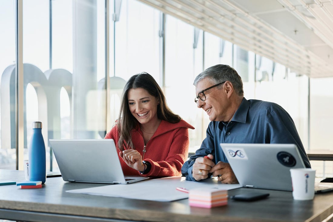 Person sitting in front of laptop, team work